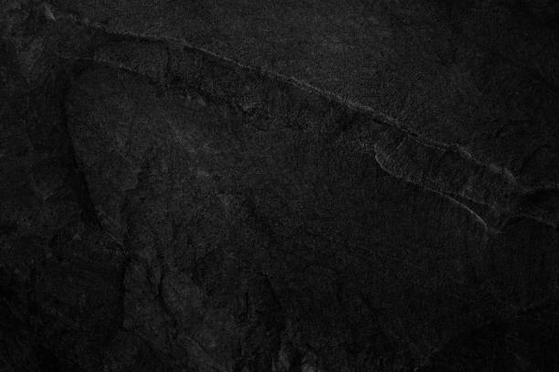 istock Dark grey black slate background or natural stone texture. 1171242514