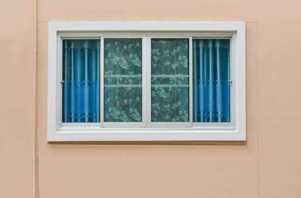 istock Modern windows with uv curtain and light brown house wall from outside view. 1171245992