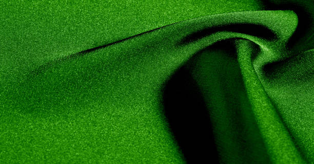 istock Background, pattern, texture, wallpaper, green silk fabric. Add a touch of luxury to any design by adding it to this ultra-soft and very lightweight polyester lining fabric. 1171249729