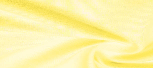 istock Texture background pattern. Knitted fabric Yellow. Stinging, xanthous. The radiance is bright like a star in this smooth and elastic yellow light jersey. Its liquid drape makes it easy to maneuver 1171249813