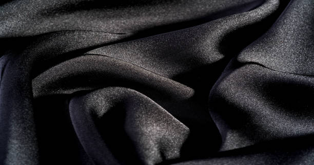 istock Background, pattern, texture, wallpaper, black silk fabric.  Add a touch of luxury to any design, putting it in this ultra-soft and very lightweight polyester lining fabric. 1171249831