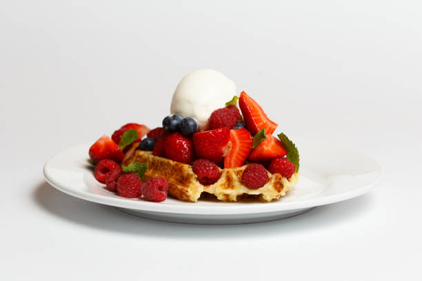 istock Belgian waffle with ice cream and a berries 1171254663