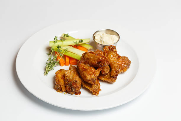 istock grilled chicken wings with herbs and a asparagus 1171255544