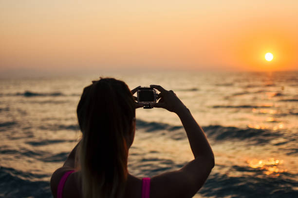 istock Woman taking selfie with Action Camera 1171256618