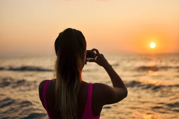istock Woman taking selfie with Action Camera 1171256652