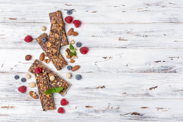 istock Granola energy bar with fresh raspberry, blueberry and mix of nuts 1171256704