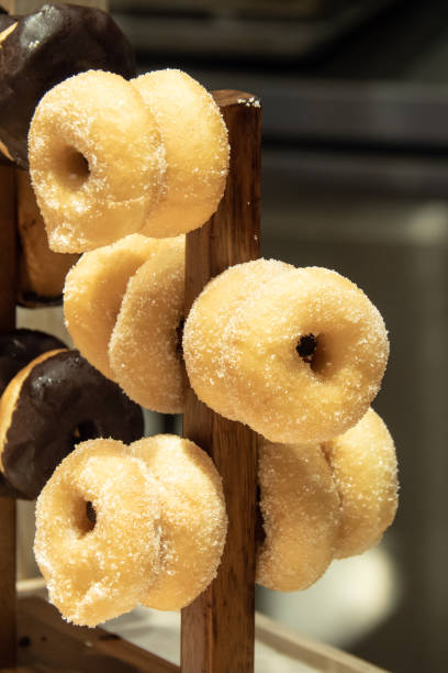 istock hanging fresh sugar donut for breakfast. 1171258907