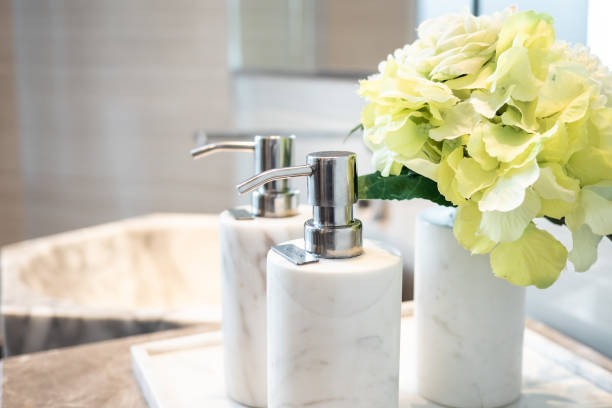 istock soap shampoo, and lotion pump bottle in toilet. 1171258938