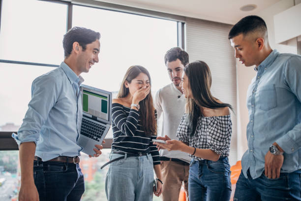 istock Millennial friends watching mobile phone 1171260636