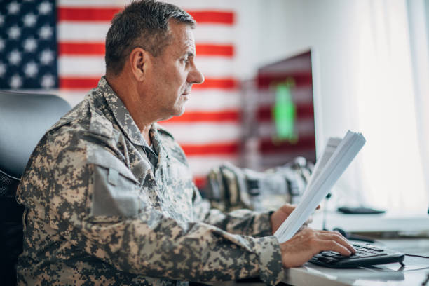 istock Army soldier working on clasified document 1171261022