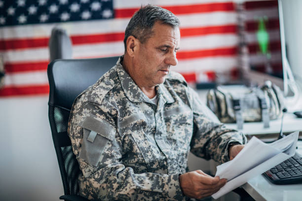 istock Army soldier working on clasified document 1171261039