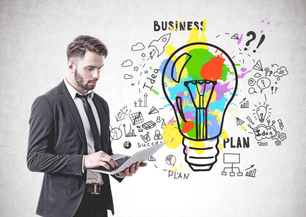 istock Serious businessman with laptop, business idea 1171263959
