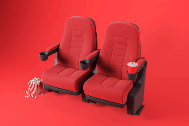 istock Two comfortable red cinema chairs on red 1171264161
