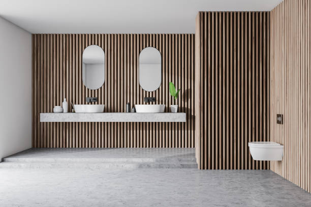 istock Light wooden bathroom, double sink and toilet 1171264783