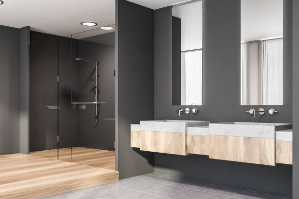 istock Corner of grey bathroom, double sink and shower 1171265168