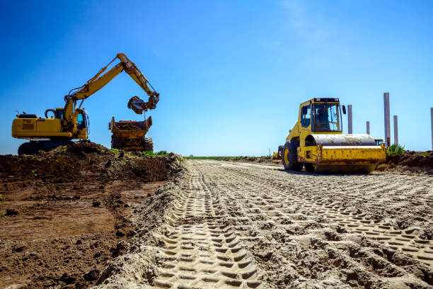 Trace of huge road roller with spikes to compact soil at construction Pattern tracks of huge road roller with spikes, compacting soil for a road foundation at building site. compact soil stock pictures, royalty-free photos & images