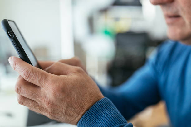 istock Businessman uses mobile phone 1171266207