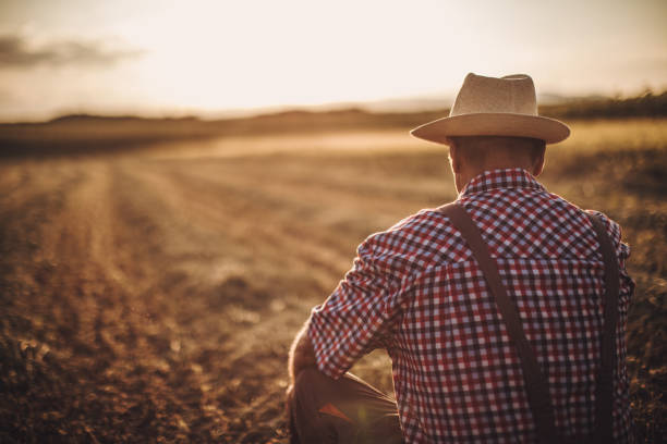 istock The farmer sitting in an agricultural field 1171269253