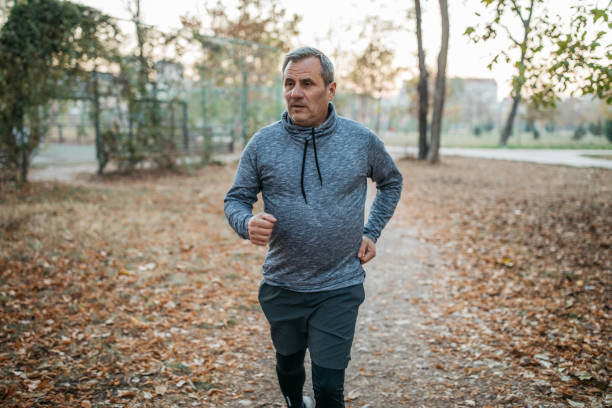 istock Mature fit man jogging 1171275181
