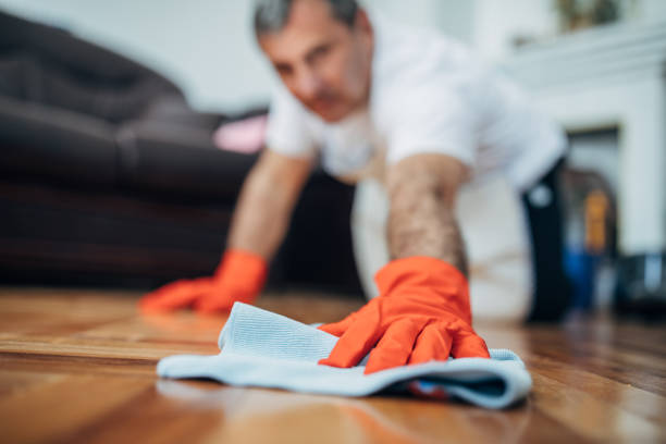 istock An older man is cleaning the house 1171277170