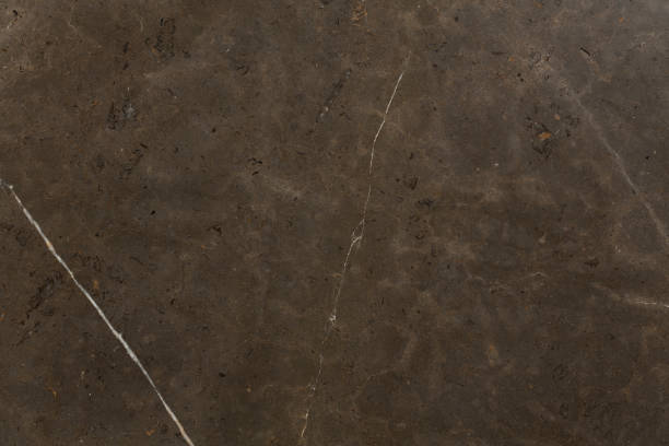 istock Dark brown marble texture with natural pattern for background or design art work. 1171279423