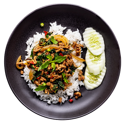 This delicious dish is made of fresh minced pork, cooked in hot oil in a wok mixed with fresh holy basil, fresh chili, onion and garlic with seasoning. This dish is normally served on top of fresh steamed rice and can be served with a fried egg which complements the dish very well and is very popular. This popular Thai recipe is found across Thailand being recognized as a quick tasty dish, it can be ordered in restaurants but is well known for being a popular street food dish.