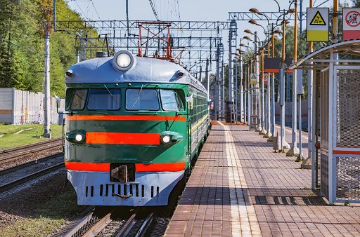 Retro passenger train moves from Mytischi to Moscow. This type of the trains was made in Riga in 1964—1970 yy.