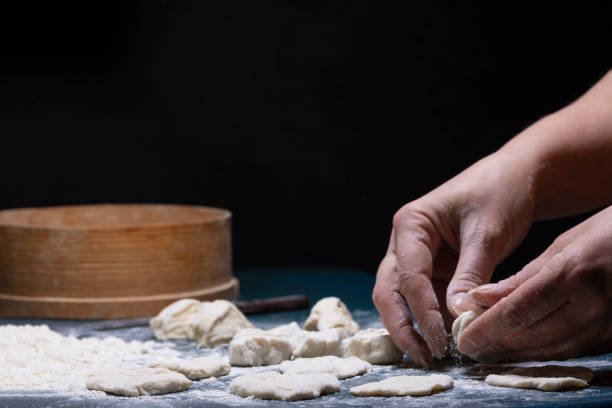istock pieces of dough on the table. 1171286903