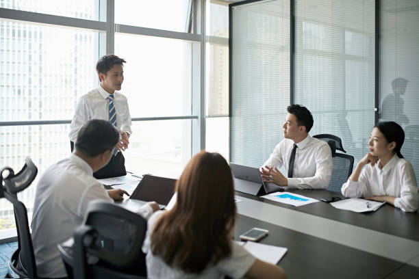 istock Businessman giving presentation to colleagues 1171288116