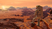 astronaut on planet Mars watching the rising Sun (3d space illustration)