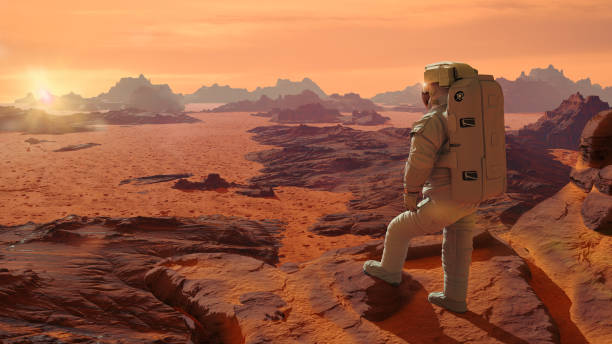 astronaut on planet Mars watching the rising Sun (3d space illustration) beautiful martian landscape, desert in outer space mars stock pictures, royalty-free photos & images