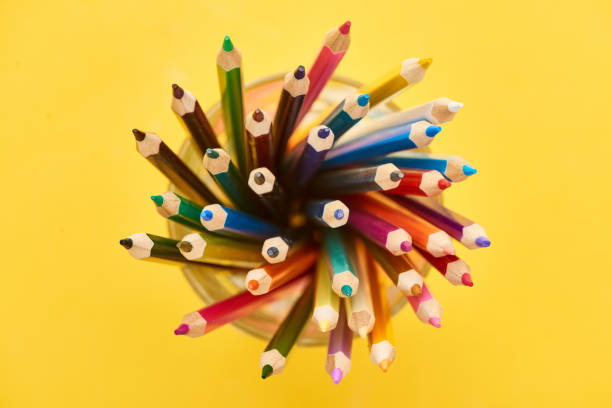 istock Top view of sharpened and bright color pencils isolated on yellow 1171291698