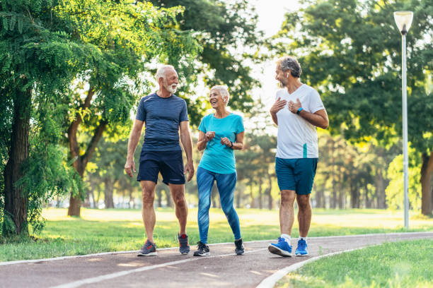 istock Senior friends jogging in the park 1171297351