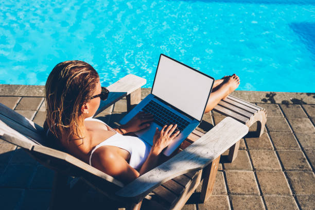 istock Female tourist freelancer typing text information on keyboard of modern laptop computer with blank copy space screen for your advertising information content working remotely and relaxing at the same time 1171303051