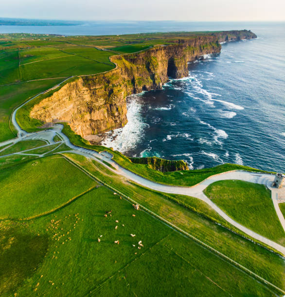 world famous cliffs of moher, one of the most popular tourist destinations in ireland. aerial view of known tourist attraction on wild atlantic way in county clare. - cliffs of moher cliff republic of ireland sea imagens e fotografias de stock