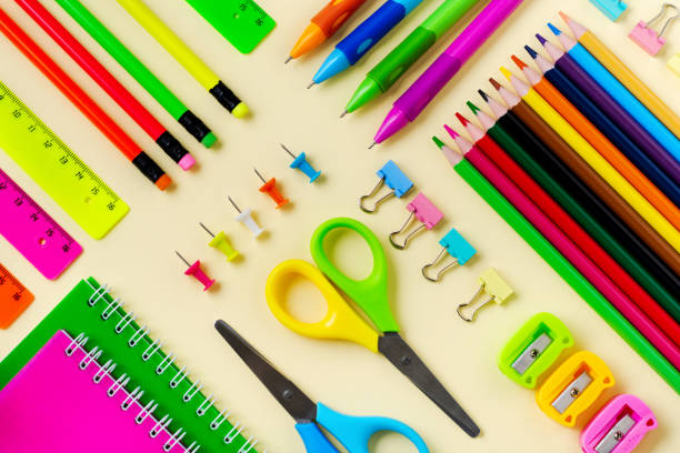 istock Notebook, colored pencils, ruler, pen, eraser, sharpener and more. School and office stationery on yellow background. Concept back to school. Top view. 1171308186