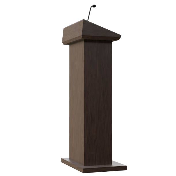 istock Wooden podium with a microphone 1171308804