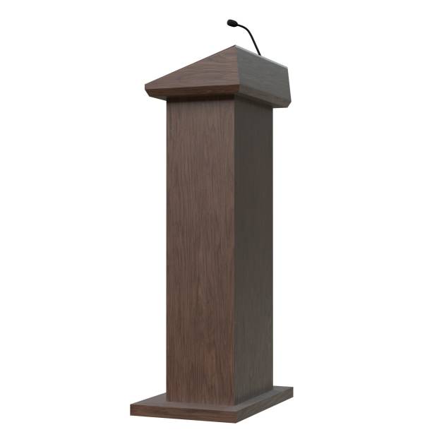 istock Wooden podium with a microphone 1171308811