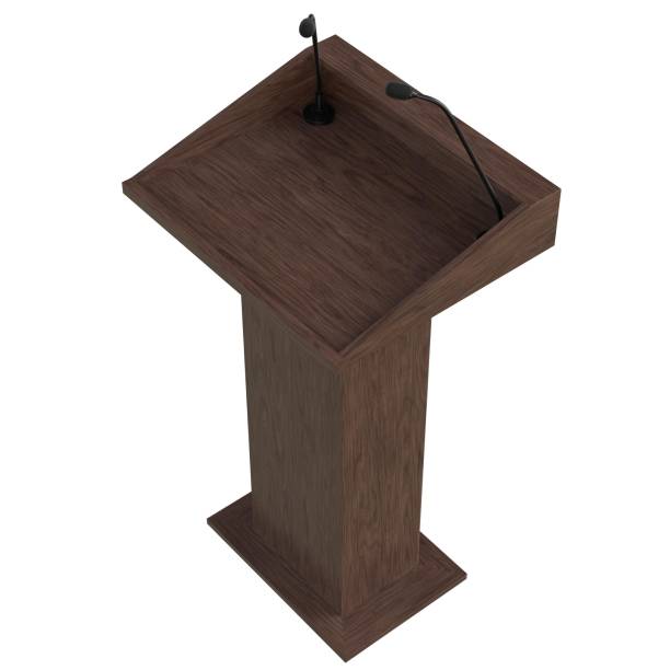 istock Wooden podium with two microphones 1171310085