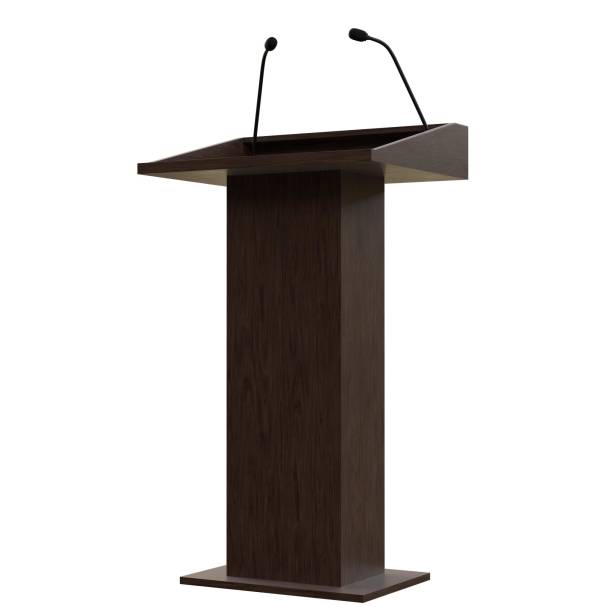 istock Wooden podium with two microphones 1171310171