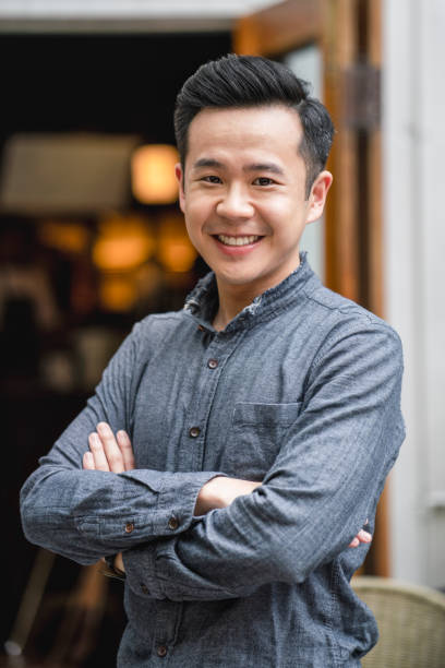 istock Handsome young male owner with arms crossed 1171319991