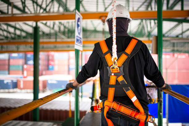 istock Construction worker wearing safety harness and safety line working on construction. 1171320000