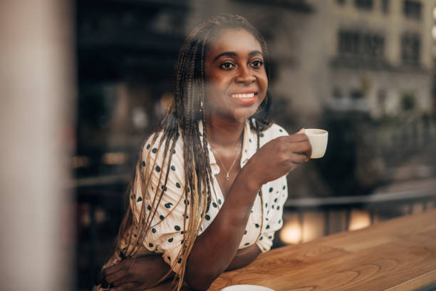 istock Young woman drinking coffee at the cafe 1171321797