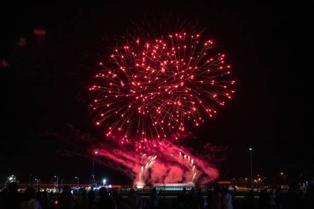 istock people look at the festive bright fireworks in the night sky 1171324232