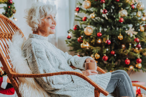 istock Gray-haired female is holding cup of coffee 1171326066