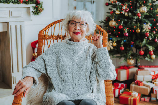istock Cheerful senior female is resting in chair 1171326092