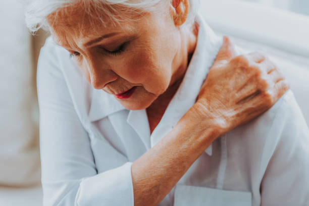 istock Senior female is feeling sharp pain in the shoulder 1171326138