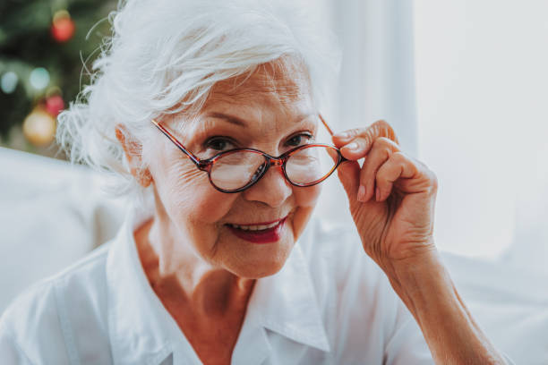 istock Charming old woman is looking at camera 1171326141