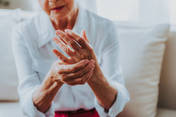istock Senior lady is feeling arm ache at home 1171326149