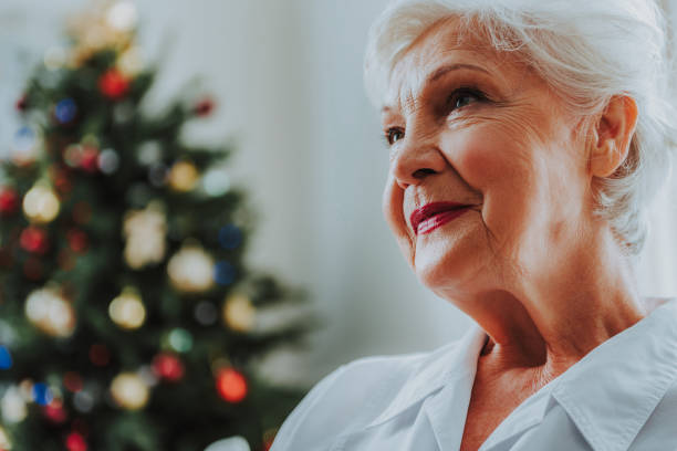 istock Happy old lady is dreaming at home 1171326159
